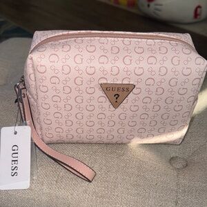 NWT, Guess pink  signature zip wristlet /cosmetic pouch.